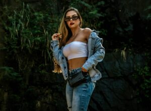 Woman with jean jacket and tube top looking beautiful